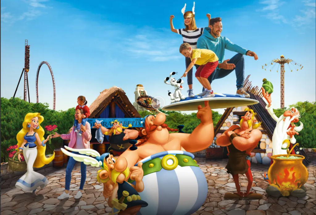 Parc Astérix promotional image showing Astérix, Obélix and other comic characters alongside a family on a park ride, with roller coasters and Gaulish village buildings in the background.