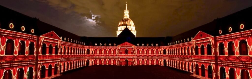 Les Invalides lit in red at night