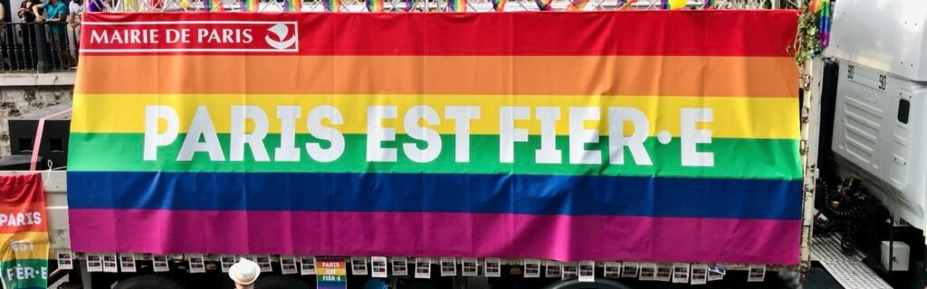 A rainbow banner reading Paris est fière